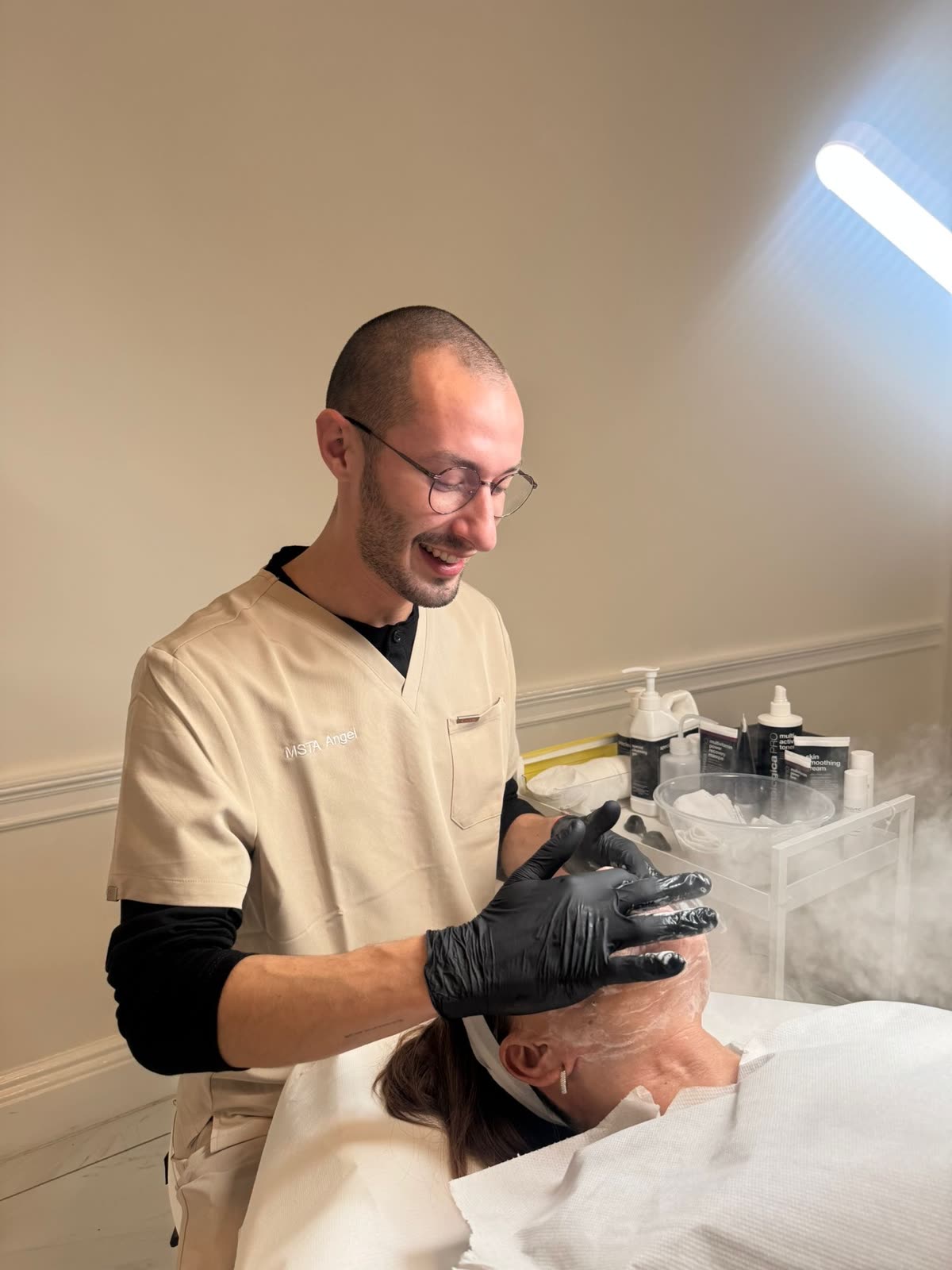 Adam Lovell giving a facial treatment at L&oslash;vell Skinn